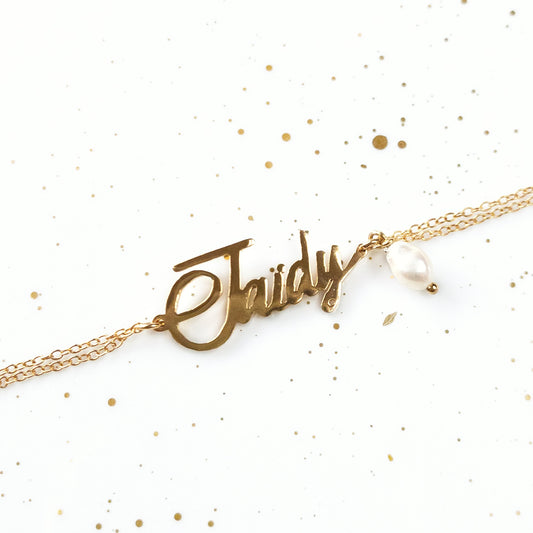 Pulsera con nombre y perlas